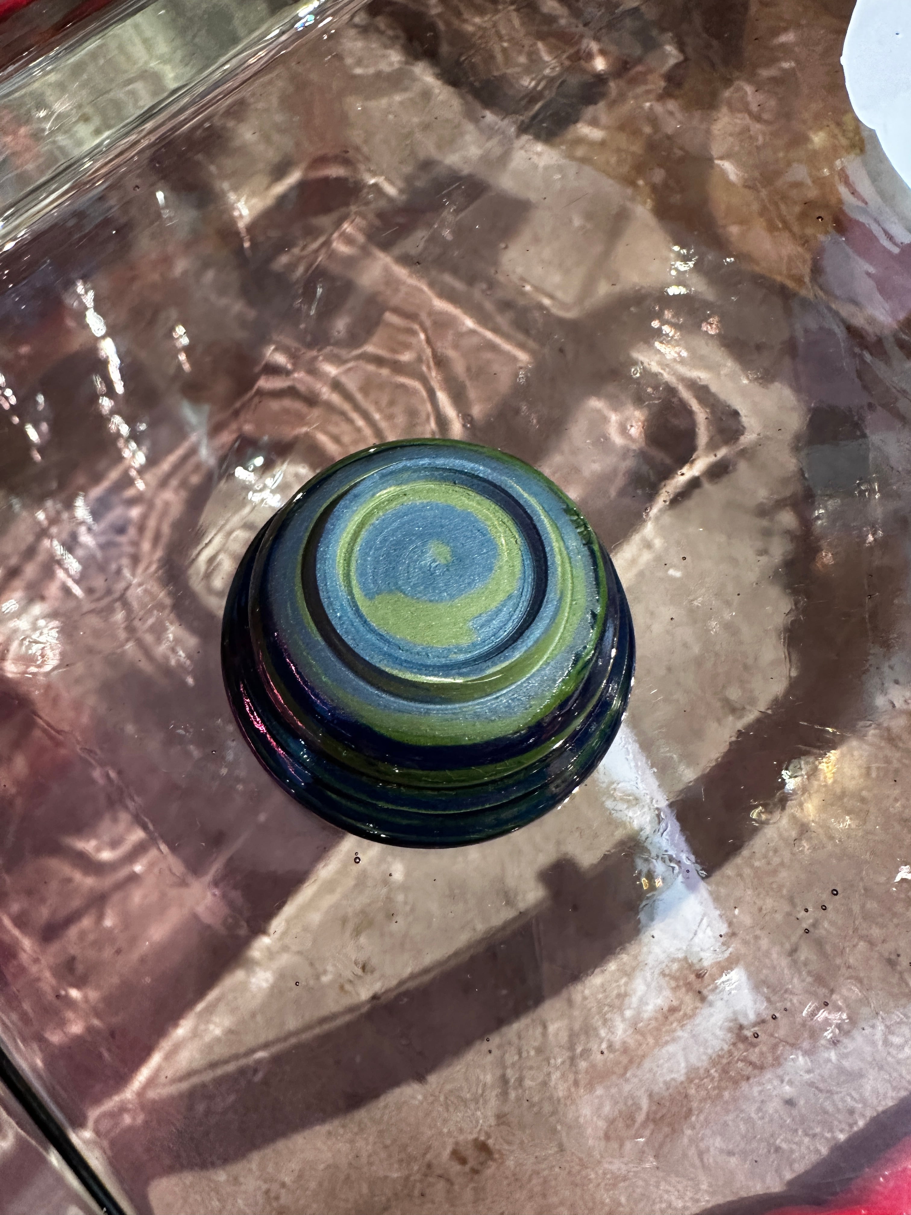 Bottom of a blue and green ceramic bowl